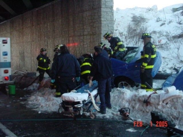 Districts 9 and 11 work at extricating the driver at a fatal MVA, Route 9 South February 1, 2005.